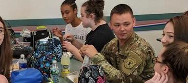 North Syracuse Junior High students spend lunch period learning from local military